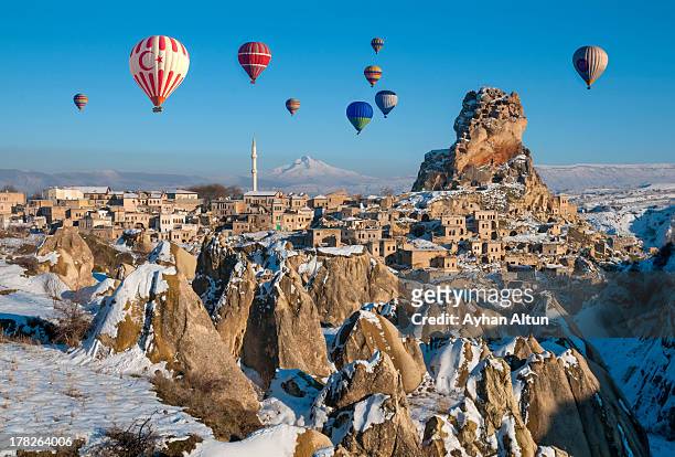 hot air ballooning over ortahisar in cappadocia - cappadocia hot air balloon stock pictures, royalty-free photos & images