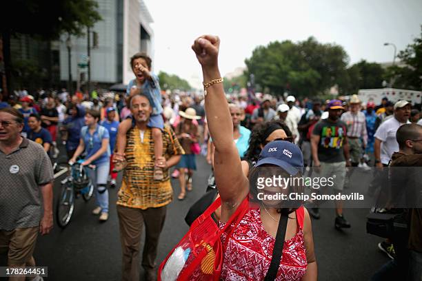 Joyce Elliotte of Temple Hills, Maryland, joins thousands of people as they march from Capitol Hill to the Lincoln Memorial during the 'Let Freedom...