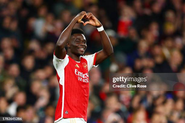 Bukayo Saka of Arsenal celebrates after scoring the team's second goal during the UEFA Champions League match between Arsenal FC and Sevilla FC at...