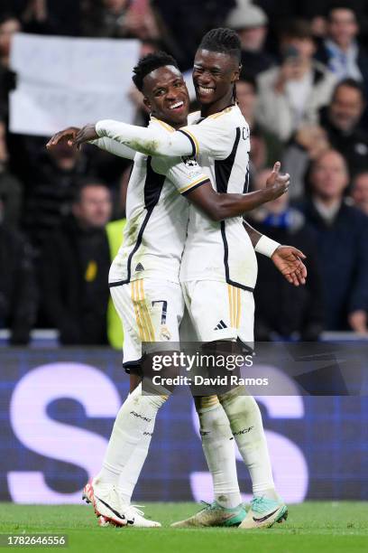 Vinicius Junior of Real Madrid celebrates after scoring the team's second goal with teammate Eduardo Camavinga during the UEFA Champions League match...