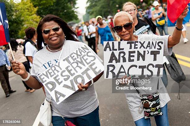 Patricipants walk in the March for Jobs and Justice in Washington, D.C., U.S., on Wednesday, Aug. 28, 2013. The march is part of the Let Freedom Ring...