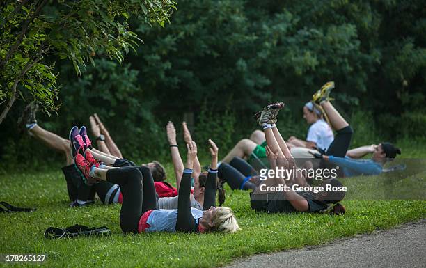 Group of people particpate in a military-style physical workout along the Saskatchewan River near downtown on July 1, 2013 in Edmonton, Alberta,...