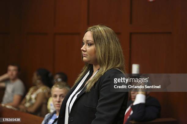 Shellie Zimmerman, wife of George Zimmerman, enters Circuit Judge Marlene M. Alva's courtroom to plead guilty to a lesser form of perjury at the...