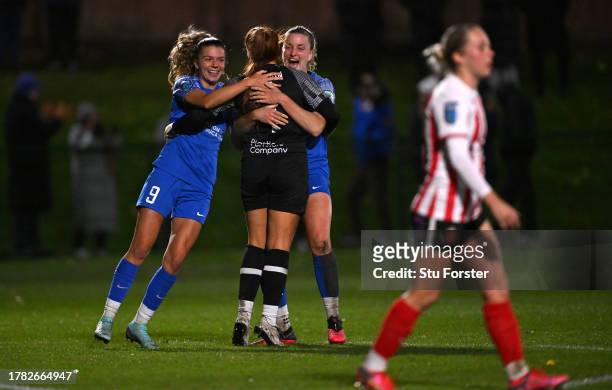 Dutrham goalkeeper Naoisha McAloon is congratulated by players Amy Andrews and Dee Bradley after her three penalty saves in the shoot out after a 2-2...