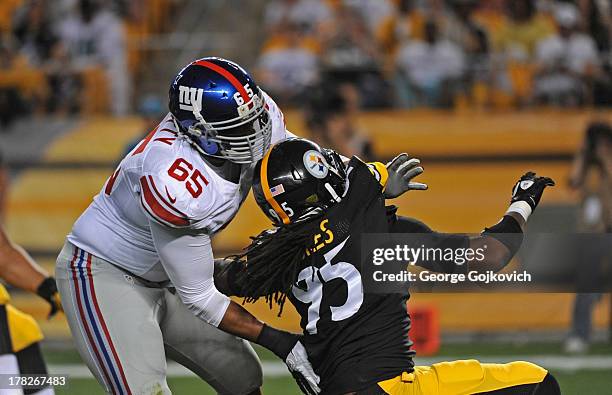 Offensive lineman Will Beatty of the New York Giants blocks linebacker Jarvis Jones of the Pittsburgh Steelers during a preseason game at Heinz Field...