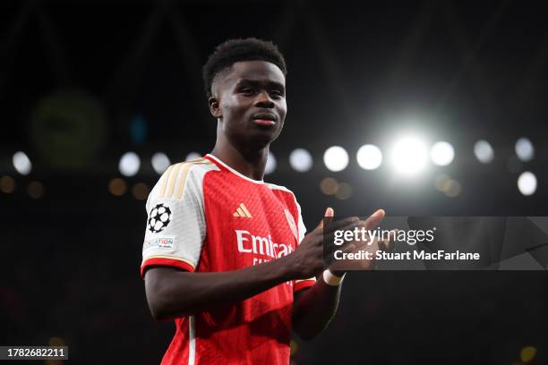 Bukayo Saka of Arsenal applauds the fans as they leave the field during the UEFA Champions League match between Arsenal FC and Sevilla FC at Emirates...
