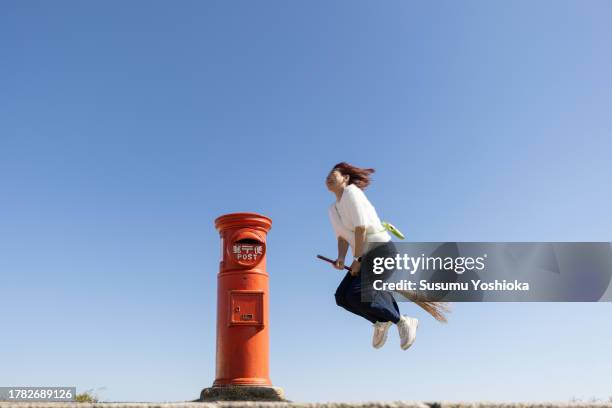 a woman enjoying a vacation trip in the fall. - funny pics of people photos et images de collection