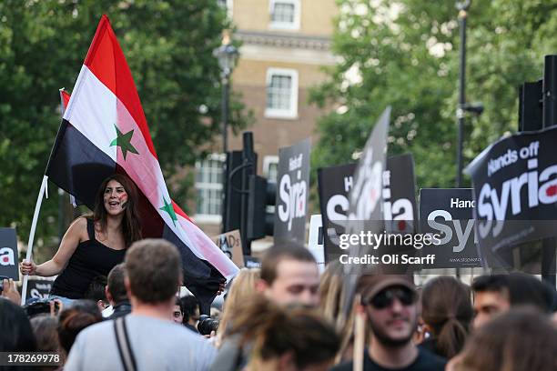 Protesters block Whitehall outside Downing Street to campaign for no international military intervention in the ongoing conflict in Syria on August...