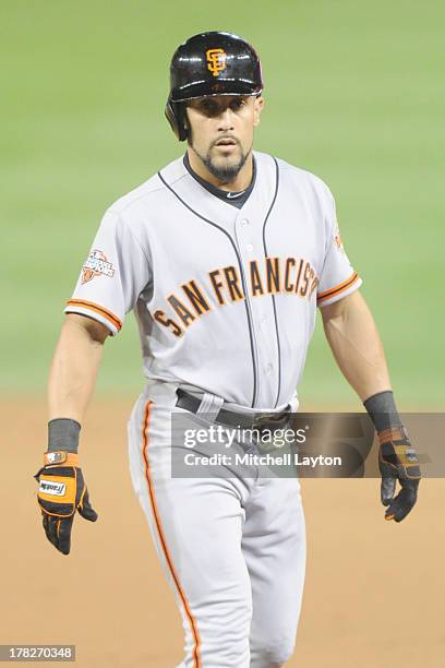 Andres Torres of the San Francisco Giants leads off first base during a baseball game against the Washington Nationals on August 14, 2013 at...