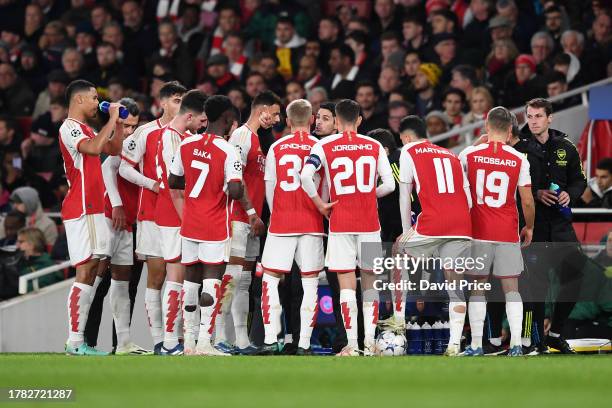 Mikel Arteta, Manager of Arsenal, speaks with the team during the UEFA Champions League match between Arsenal FC and Sevilla FC at Emirates Stadium...