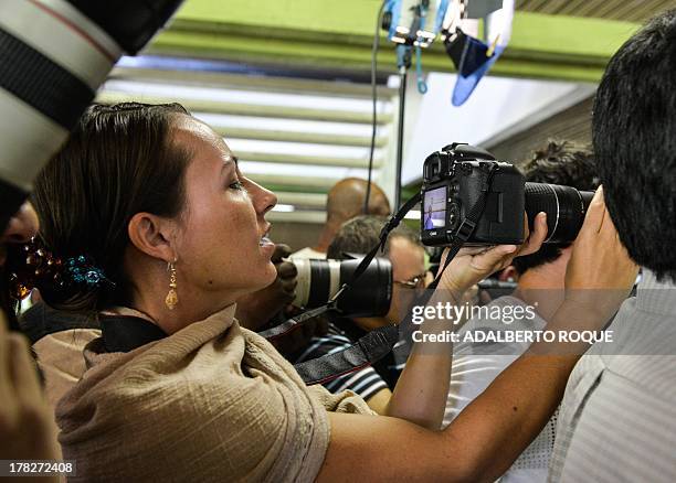 Member of FARC-EP guerrillas delegation to the peace talks with the Colombian Government, Dutch born Tanja Nijmeijer takes pictures from amidst the...