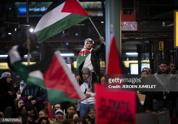 People rally to show solidarity with Gaza at Schiphol on November 14, 2023 as fighting raged in Gaza more than five weeks after Hamas's shock attack...