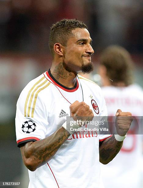 Kevin Prince Boateng of AC Milan celebrates scoring the first goal during the UEFA Champions League Play-off Second Leg match between AC Milan v PSV...