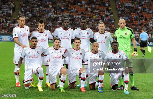 Milan players line up for a team photo before the start of the UEFA Champions League Play-off Second Leg match between AC Milan v PSV Eindhoven at...