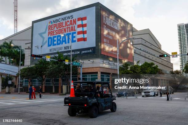 Police officers drive on a closed road outside the Adrienne Arsht Center for the Performing Arts of Miami-Dade County ahead of the third Republican...