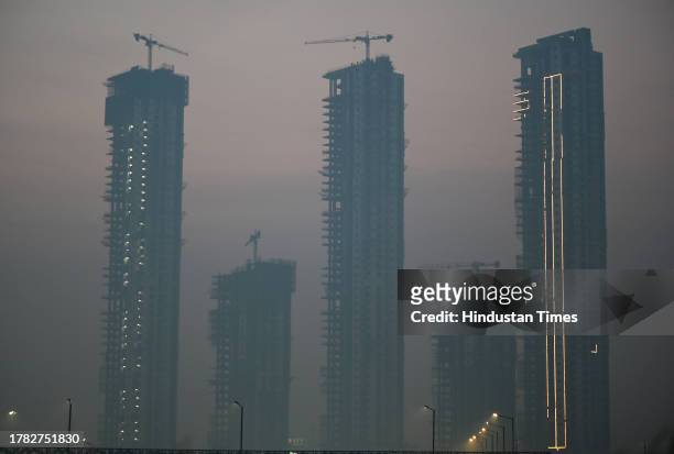 View of skyscrapers as smog gets engulfed amid rising air pollution levels, on November 14, 2023 in Noida, India. The air quality in Delhi remained...