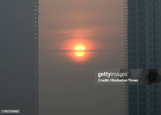 View of skyscrapers as smog gets engulfed amid rising air pollution levels, on November 14, 2023 in Noida, India. The air quality in Delhi remained...