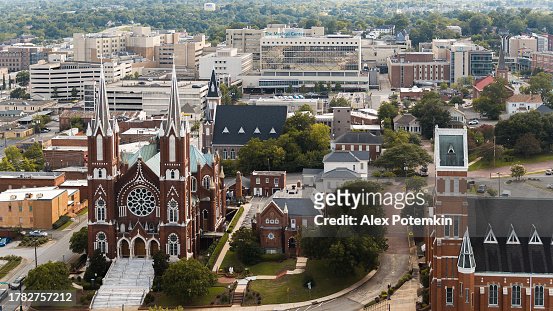 Historical landmarks of Macon, GA. St Joseph Catholic Church in English Gothic style and First Baptist Church looking over Downtown cityscape