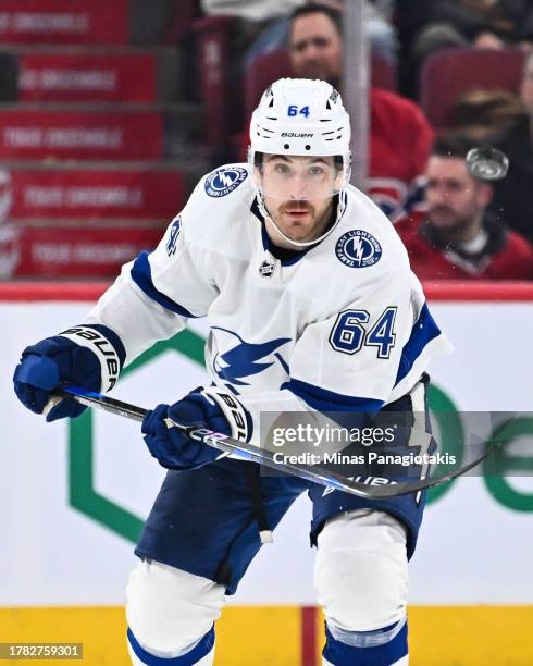 Tyler Motte of the Tampa Bay Lightning flips the puck during the third period against the Montreal Canadiens at the Bell Centre on November 7, 2023...