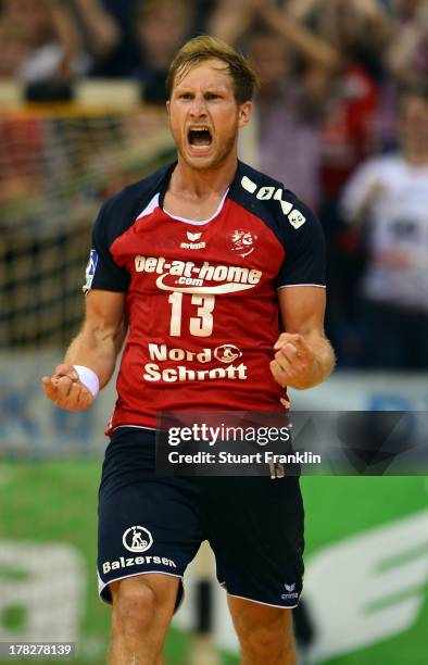 Steffen Weinhold of Flensburg celebrates scoring the winning goal in the last seconds during th DKB Bundesliga game between SG Flensburg Handewitt...