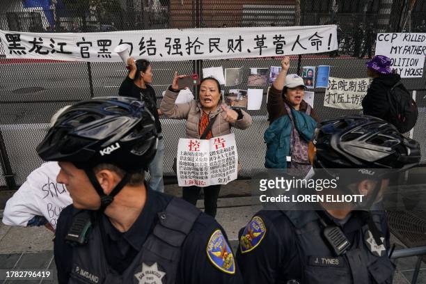 People protest the arrival of China's President Xi Jinping next to Asia-Pacific Economic Cooperation summit headquarters November 14, 2023 in San...