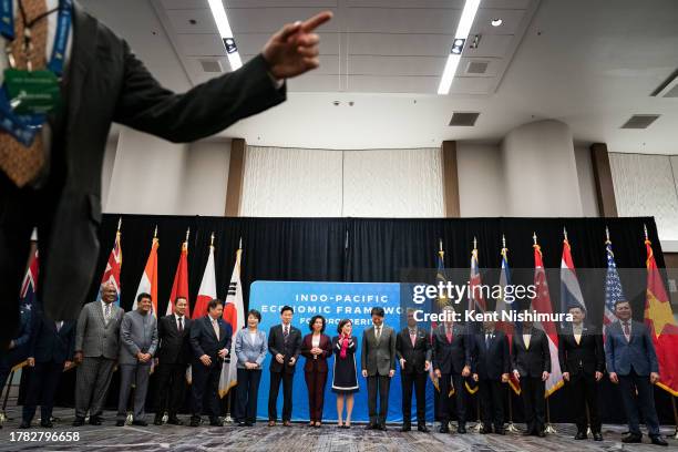 Secretary of Commerce Gina Raimondo and US Trade Representative Katherine Tai, center, and economic leaders pose for a group photo during the...