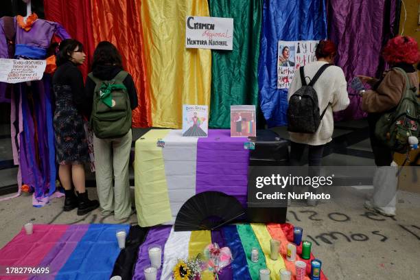 Students from the Faculty of Political and Social Sciences of the National Autonomous University of Mexico, place banners at an offering in memory of...