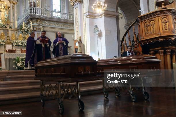 The coffins with the remains of Jesus Ociel Baena, Mexico's first openly non-binary magistrate, and their partner, are seen during a present body...