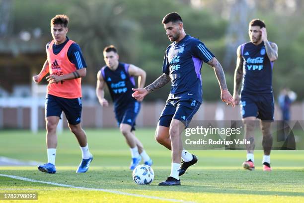 Cristian Romero of Argentina drives the ball during a training session of Argentina national team at Lionel Messi Training Camp on November 14, 2023...