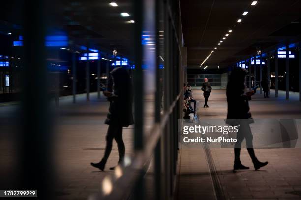 People are seen waiting at a train station in Warsaw, Poland on 14 November, 2023.