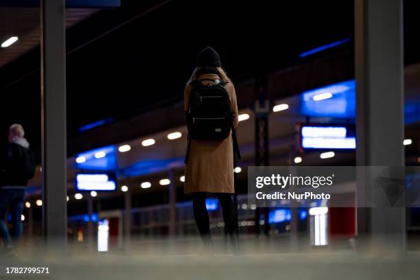 Woman is seen waiting for a train at a station in Warsaw, Poland on 14 November, 2023.