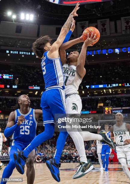 Tyrese Proctor of the Duke Blue Devils defends against the shot from A.J. Hoggard of the Michigan State Spartans during the first half in the 2023...