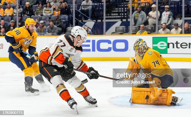 Juuse Saros of the Nashville Predators makes a save against Frank Vatrano of the Anaheim Ducks during an NHL game at Bridgestone Arena on November...