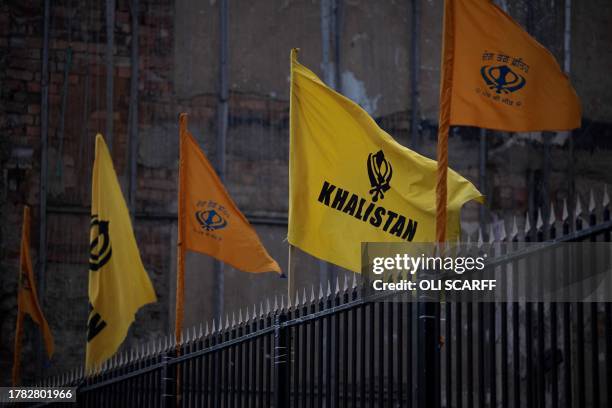 Flags promoting the movement seeking to create a homeland for Sikhs by establishing a sovereign state called Khalistan, flaps in the air outside Guru...