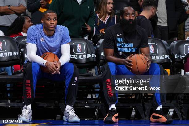 Russell Westbrook of the LA Clippers and James Harden of the LA Clippers look on before the game against the Denver Nuggets on November 14, 2023 at...