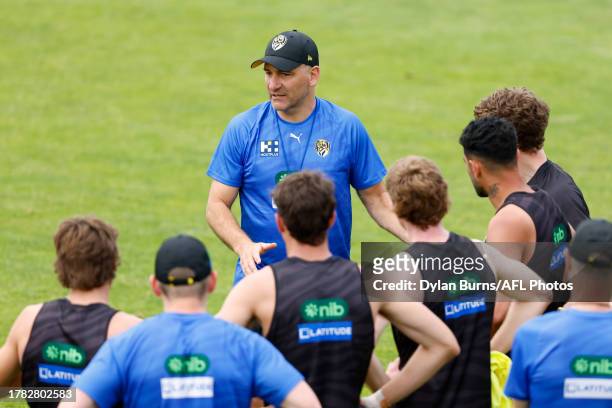 Adem Yze, Senior Coach of the Tigers addresses his players during a Richmond Tigers training session at Punt Road Oval on November 15, 2023 in...