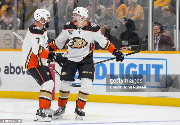 Urho Vaakanainen celebrates his goal with Radko Gudas of the Anaheim Ducks against the Nashville Predators during an NHL game at Bridgestone Arena on...