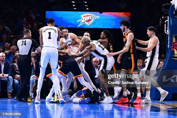 Scuffle breaks out after a hard foul by Zach Collins of the San Antonio Spurs against Vasilije Micic of the Oklahoma City Thunder during the second...