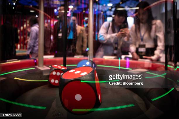 Dice shaker at the Macau Gaming Show in Macau, China, on Tuesday, Nov. 14, 2023. Macau's casinos have largely stayed on a recovery path this year,...