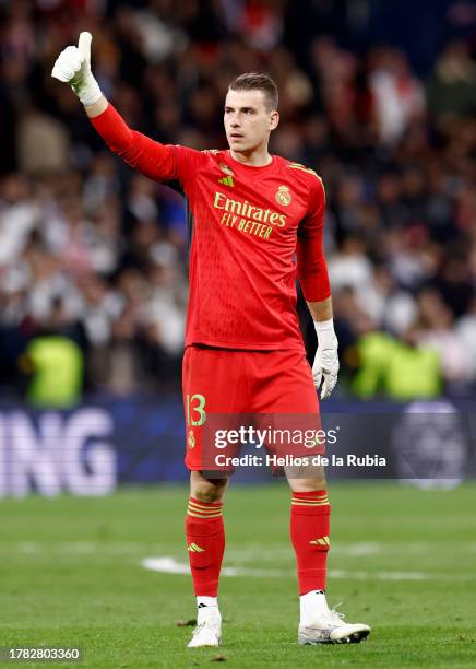 Andriy Lunin player of Real Madrid applauds the Real Madrid fans during the UEFA Champions League match between Real Madrid and SC Braga at Estadio...