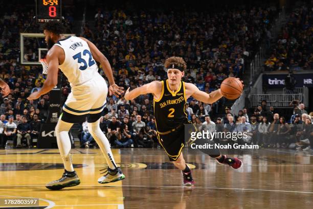 Brandin Podziemski of the Golden State Warriors dribbles the ball during the game against the Minnesota Timberwolves during the In-Season Tournament...