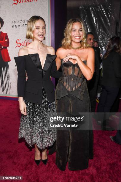 Carey Mulligan and Margot Robbie at the premiere of "Saltburn" held at Hollywood Forever Cemetery on November 14, 2023 in Los Angeles, California.