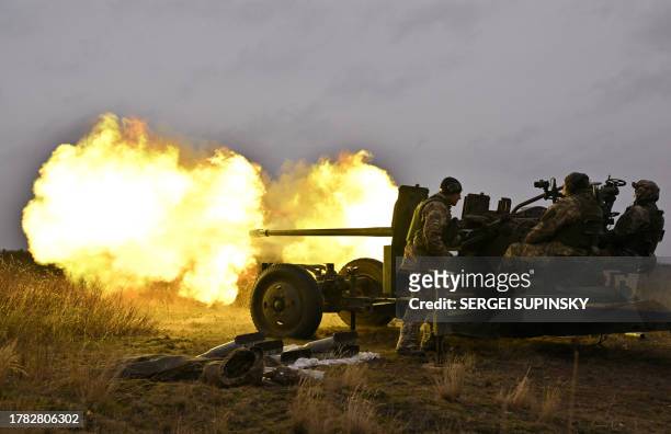 Ukrainian servicemen fire an artillery during an anti drone drill in Chernigiv region on November 11, 2023.