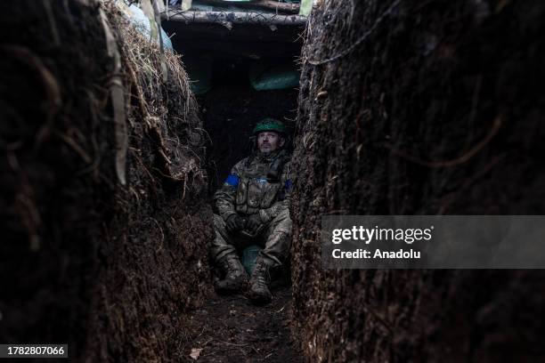 Ukrainian soldier watches the sky for drones in a trench in his infantry position in the direction of Lugansk Oblast, Ukraine on November 14, 2023.