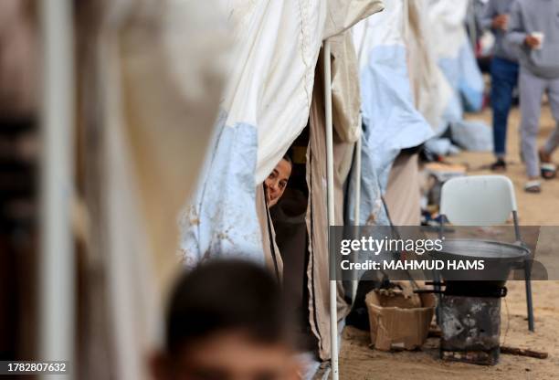 An Internally displaced Palestinian girl, who fled from the Israeli bombardment of the northern Gaza Strip and is now living in a make shift shelter,...