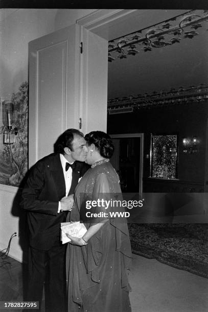 Ardeshir Zahedi greets Bennetta Bullock Washington during a party at the Iranian Embassy in Washington, D.C., on May 11, 1977.
