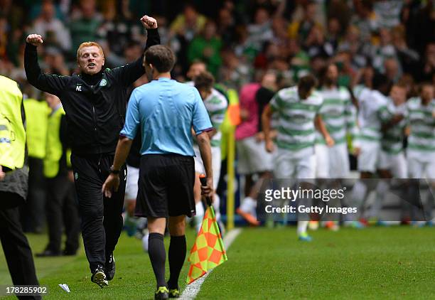 Manager Neil Lennon of Celtic celebrates after their third goal during the UEFA Champions League Play Off Round Second Leg match between Celtic and...