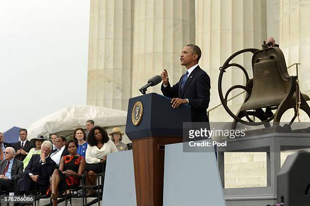 President Barack Obama delivers remarks in front of a freedom bell during the "Let Freedom Ring" commemoration event August 28, 2013 in Washington,...