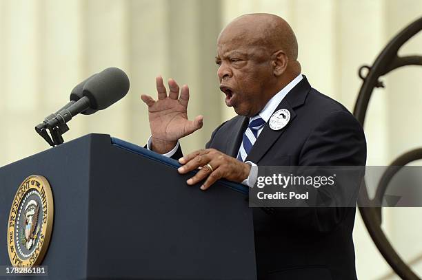Civil rights leader and Rep. John Lewis delivers remarks in front of a freedom bell during the "Let Freedom Ring" commemoration event August 28, 2013...