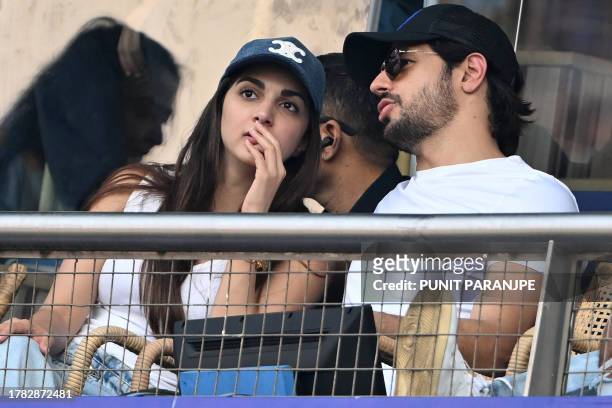 Bollywood actors Sidharth Malhotra and his wife Kiara Advani watch the 2023 ICC Men's Cricket World Cup one-day international first semi-final match...